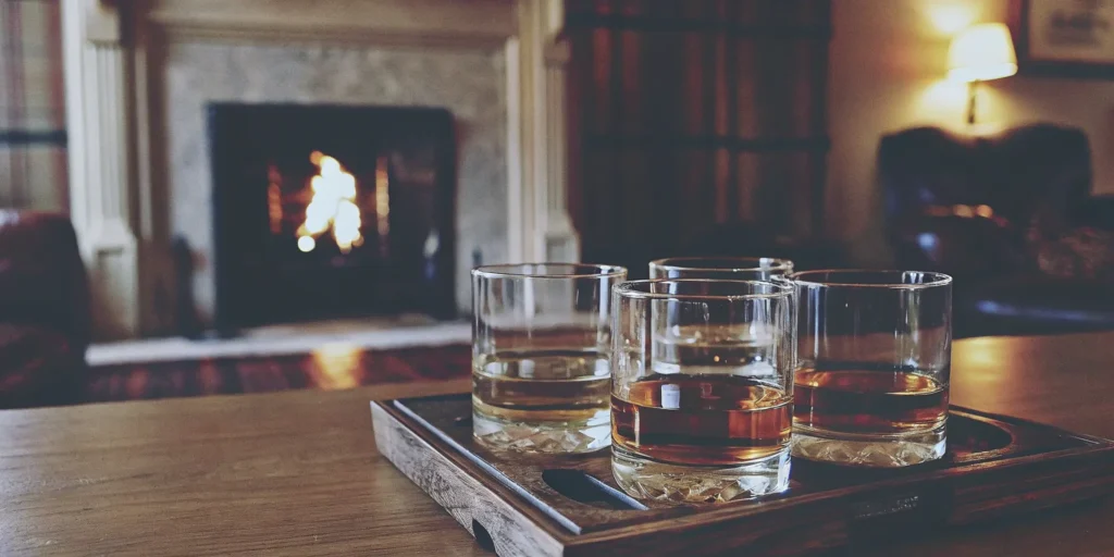 Smooth & sweet whiskeys on a wooden tray.