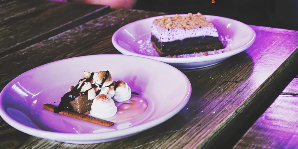 A plate of easy whiskey desserts, including rich s'mores brownies and chocolate treats.