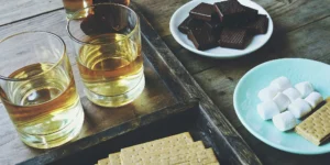 S'mores ingredients like chocolate and marshmallows are a creative mix for chocolate whiskey.