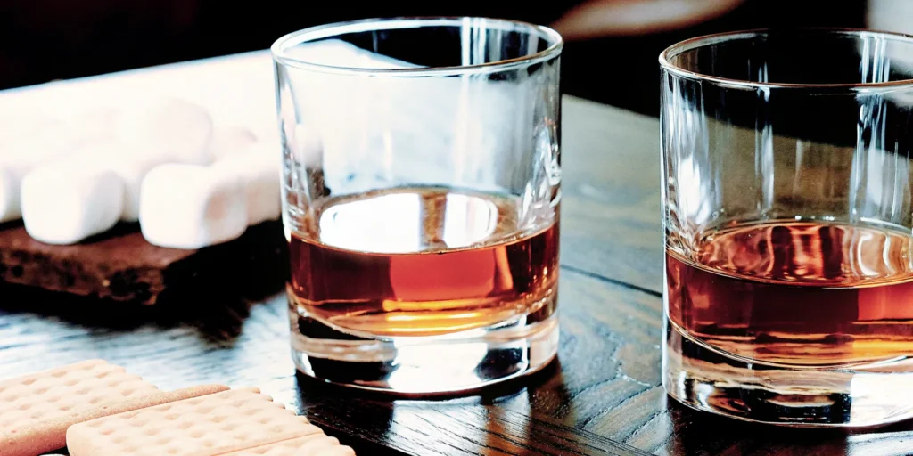 A pour of a sweet whiskey brand with marshmallows and graham crackers.