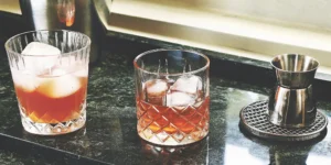How to serve bourbon on the rocks in glasses with a jigger for measuring.