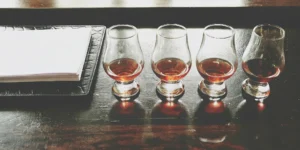 Learning how to taste bourbon with Glencairn glasses and a tasting notebook.