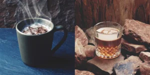 A mug of rich hot chocolate with whiskey, garnished with toasted marshmallows.
