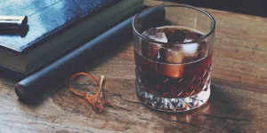 A glass of a chocolate bourbon drink on the rocks, made from a new recipe.